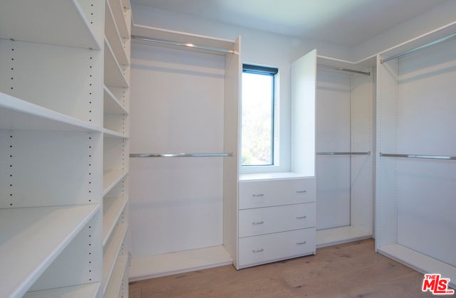 a view of an empty walk in closet