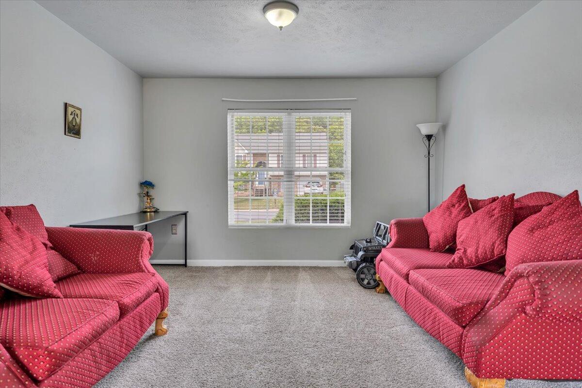 4751 Westvale Road Northeast Roanoke, VA 24019 - Photo 21 of 30 a living room with furniture and a window