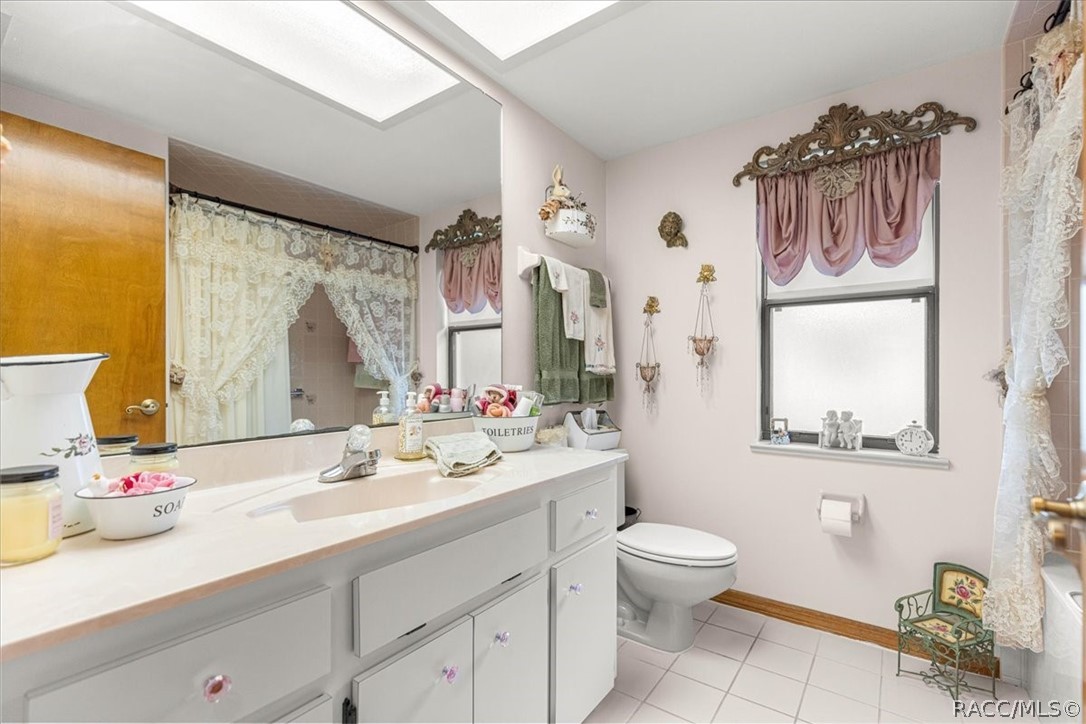 2964 South Cygnet Terrace Inverness, FL 34450 - Photo 32 of 67 a bathroom with a granite countertop sink mirror vanity and toilet