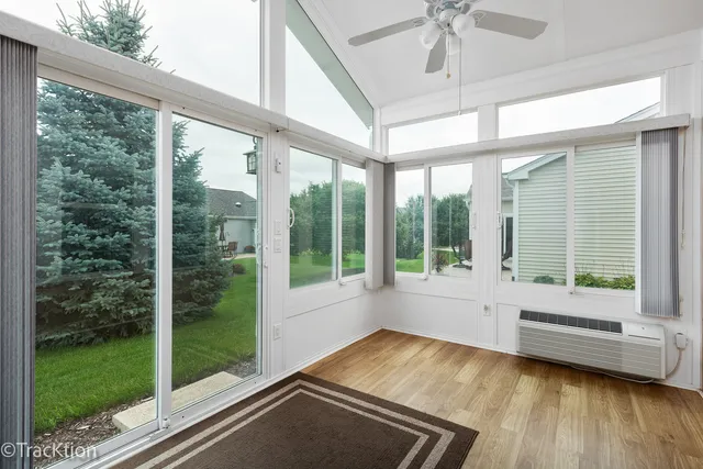 a view of a room with window wooden floor and garden