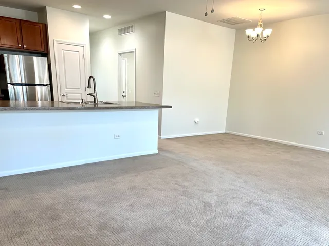 a view of kitchen with wooden floor and staircase