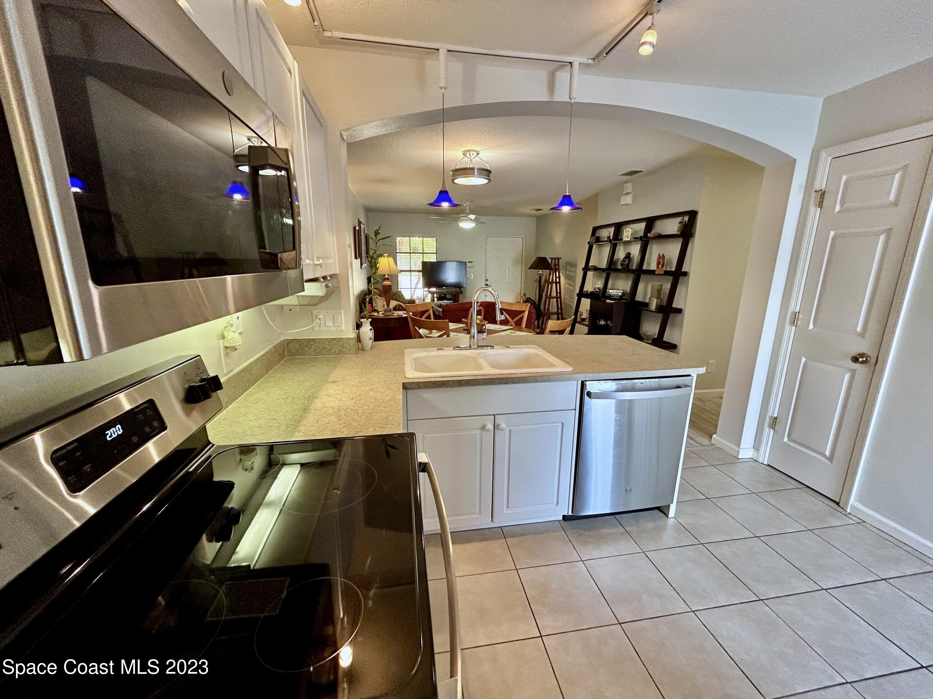 1160 Luminary Circle, Unit 105 Melbourne, FL 32901 - Photo 15 of 35 a room with pool table and flat screen tv