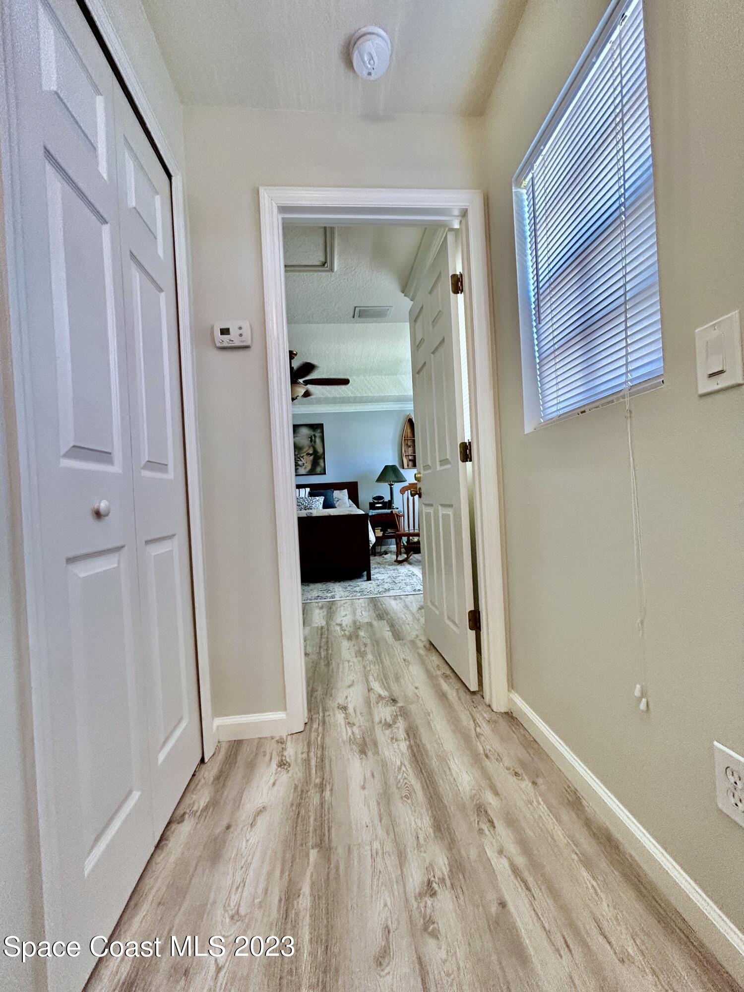 1160 Luminary Circle, Unit 105 Melbourne, FL 32901 - Photo 17 of 35 a view of empty room with wooden floor