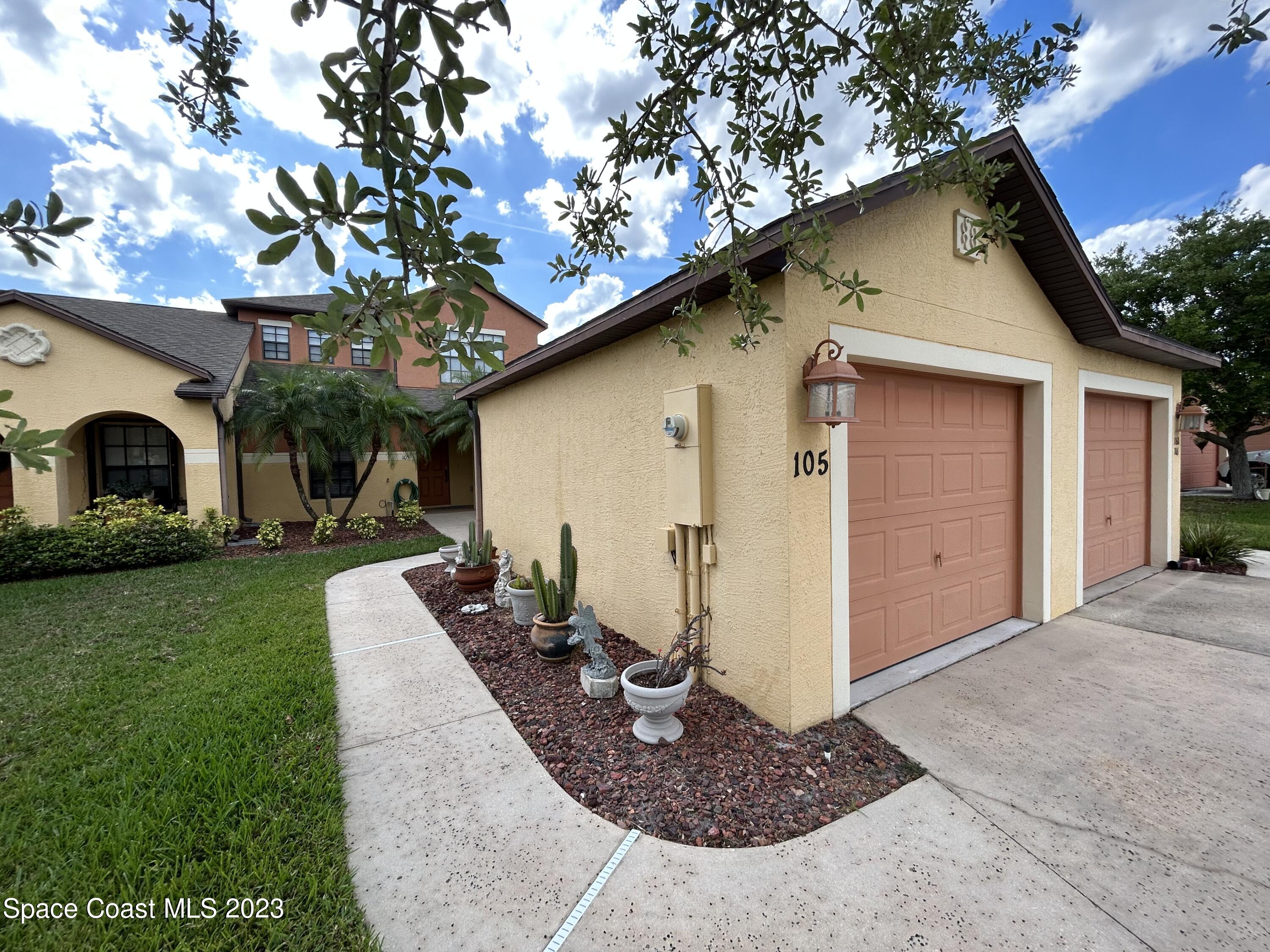1160 Luminary Circle, Unit 105 Melbourne, FL 32901 - Photo 2 of 35 a view of a house with a yard