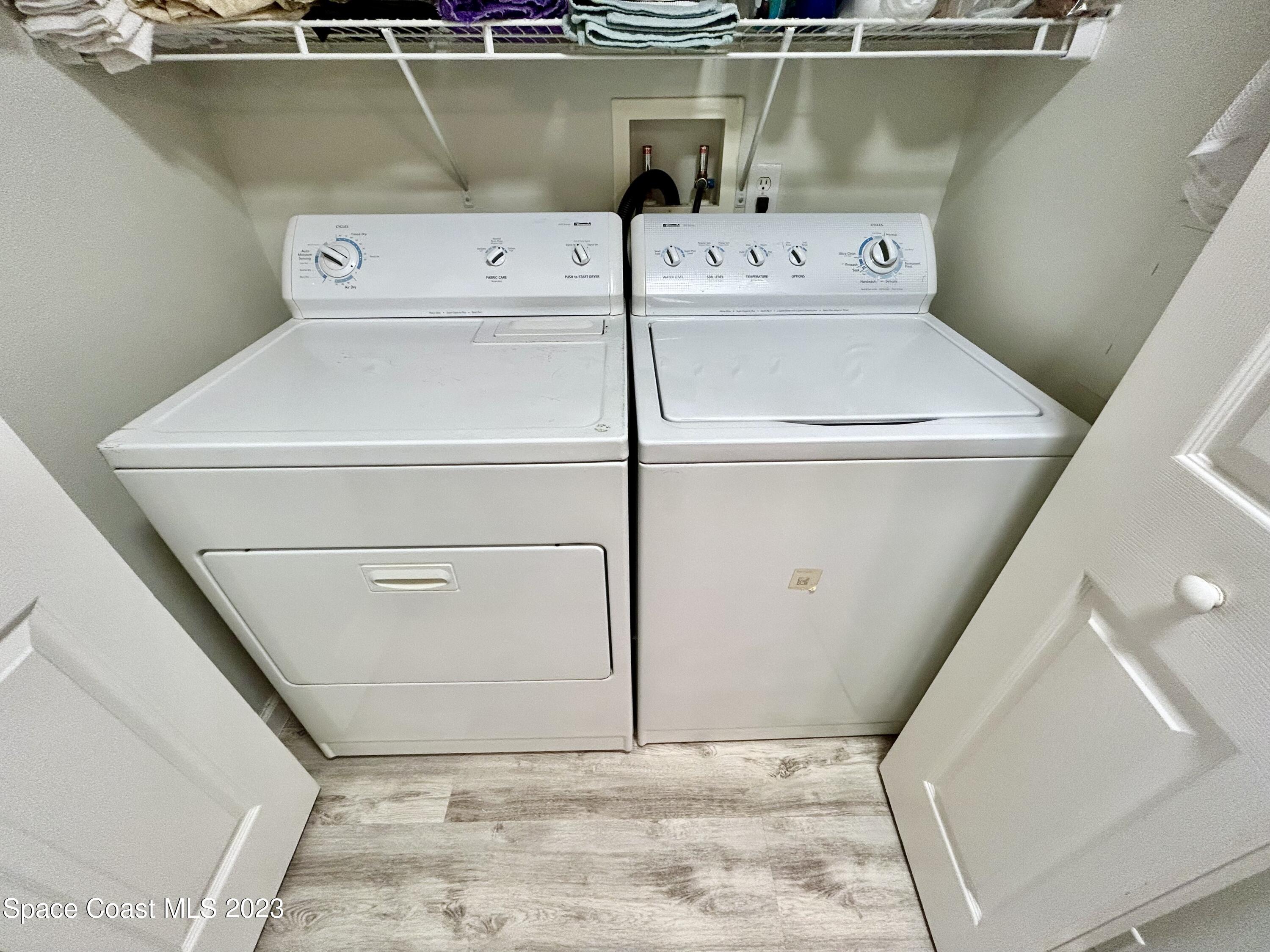1160 Luminary Circle, Unit 105 Melbourne, FL 32901 - Photo 30 of 35 a utility room with washer and dryer