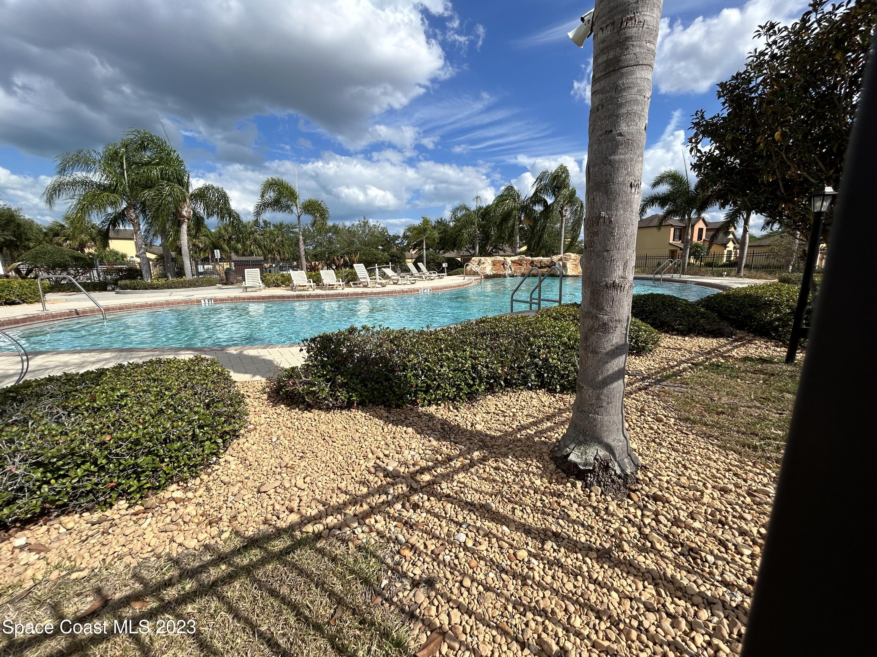 1160 Luminary Circle, Unit 105 Melbourne, FL 32901 - Photo 3 of 35 a view of a yard with plants