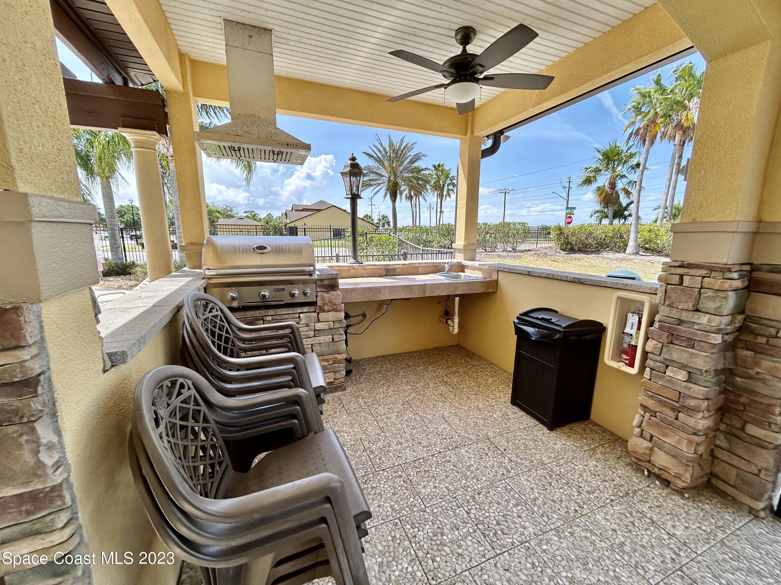 1160 Luminary Circle, Unit 105 Melbourne, FL 32901 - Photo 32 of 35 a table and chairs in a room