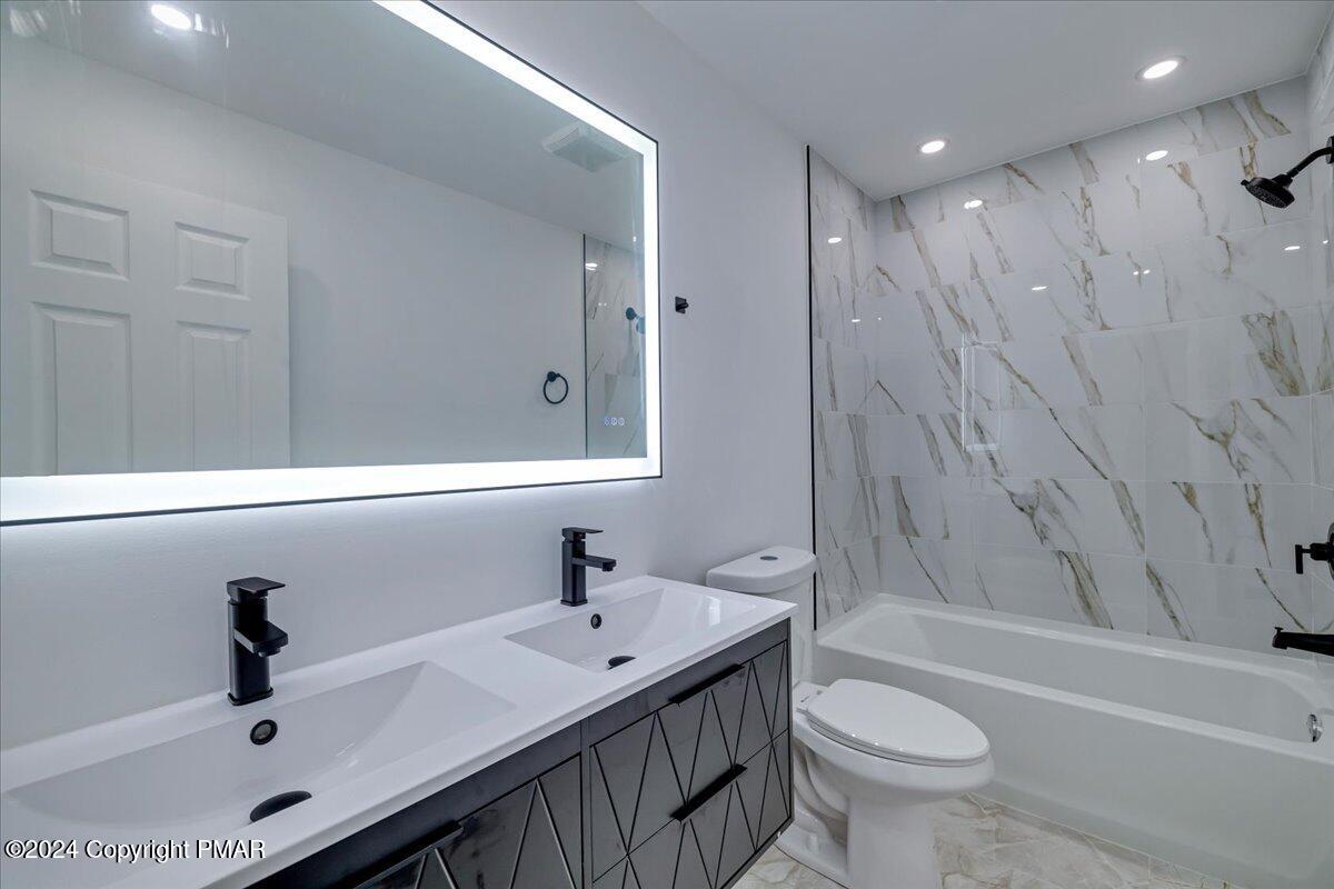 177 Sawmill Road Long Pond, PA 18334 - Photo 34 of 47 a bathroom with a sink and a bathtub
