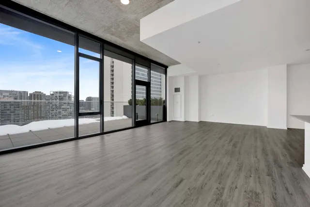 a view of livingroom with furniture and floor to ceiling window