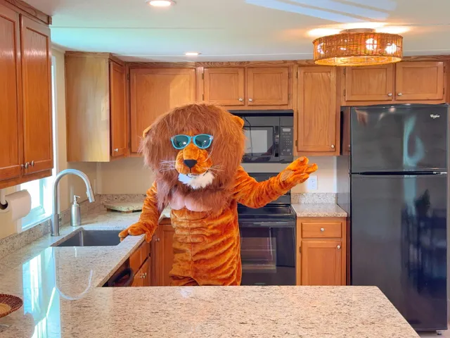 a kitchen with a refrigerator and a sink
