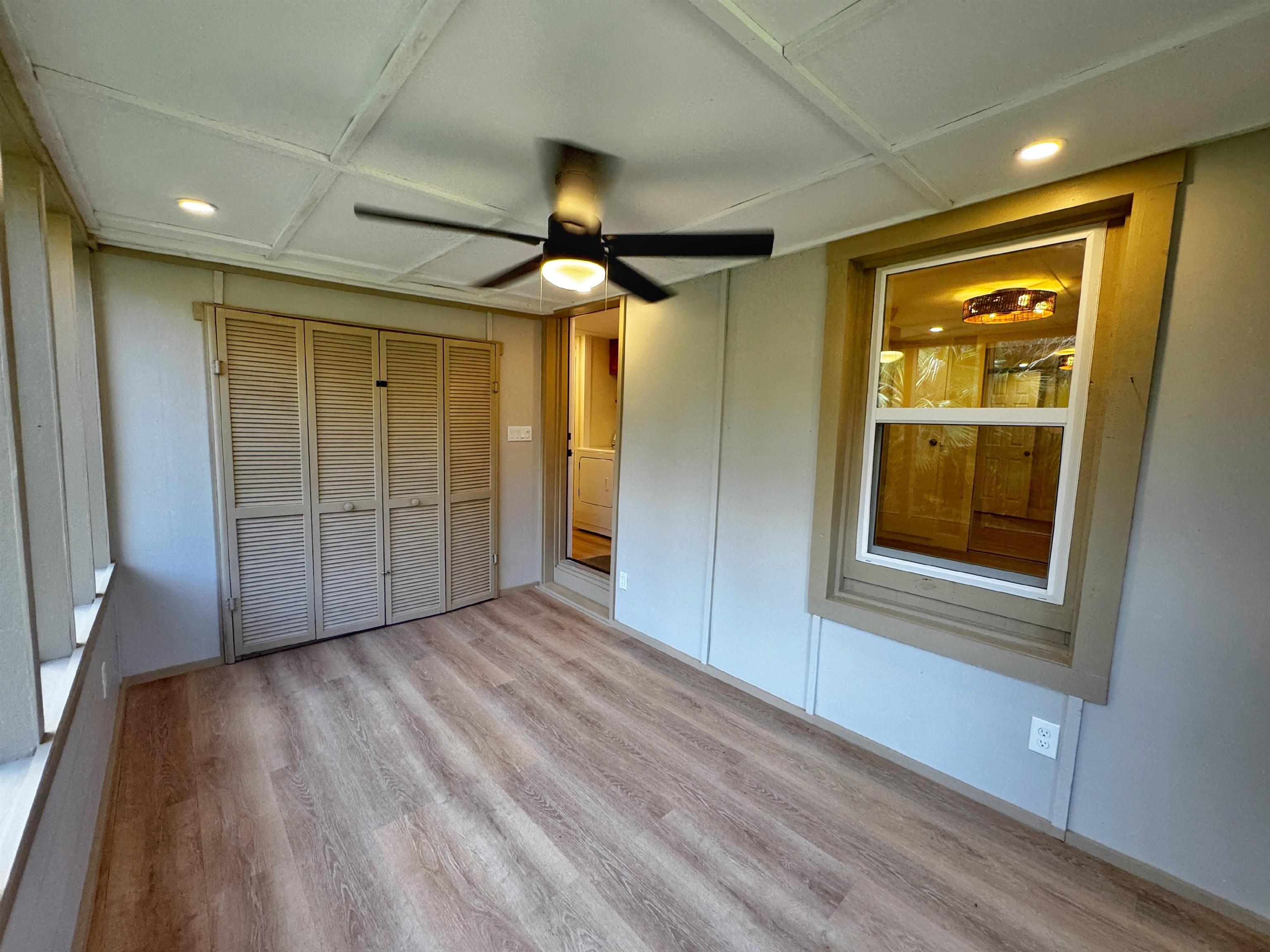 4062 Quail Drive St. Augustine, FL 32084 - Photo 36 of 39 a view of an empty room with wooden floor and a window