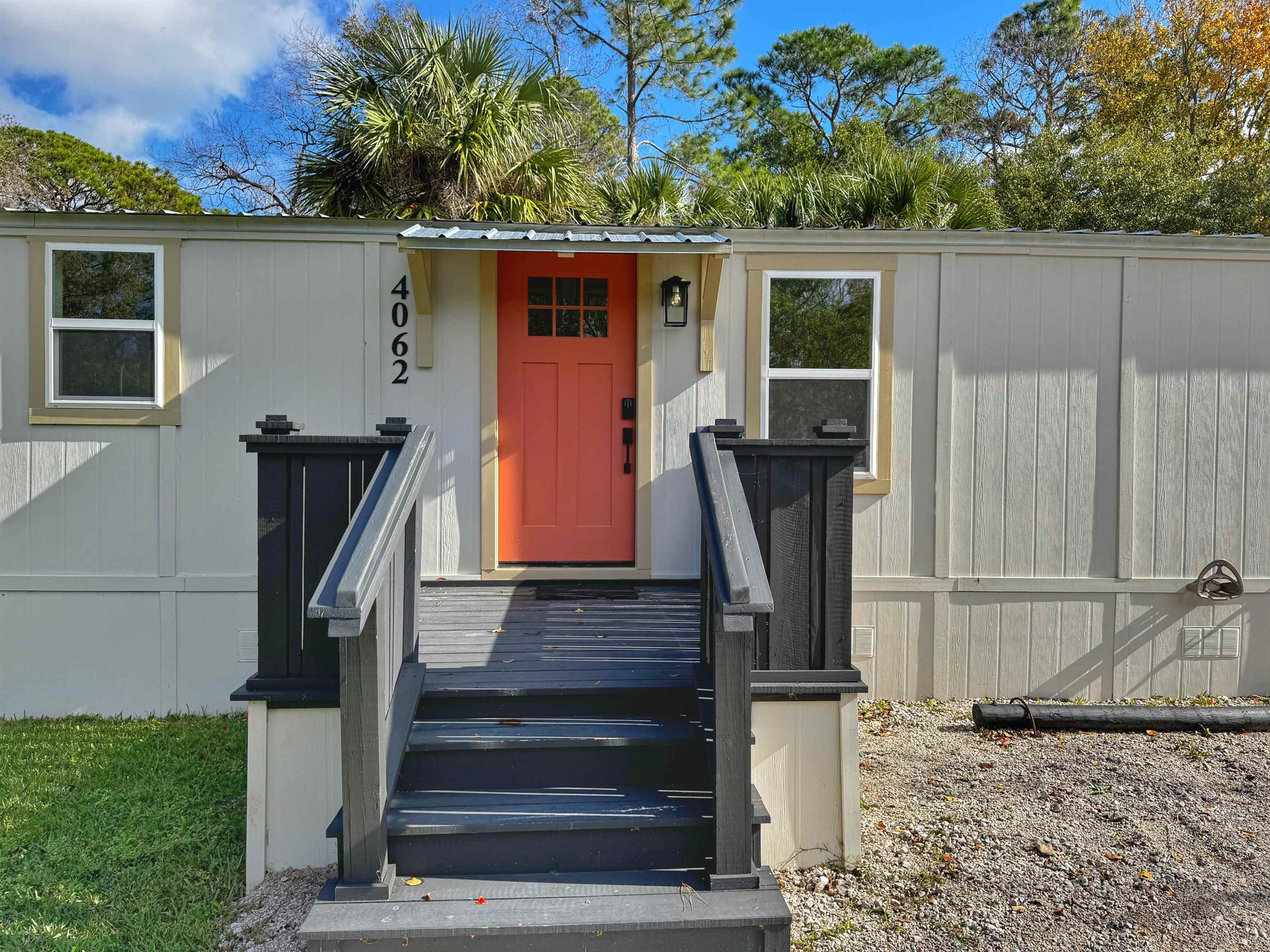 4062 Quail Drive St. Augustine, FL 32084 - Photo 4 of 39 a front view of a house with garden