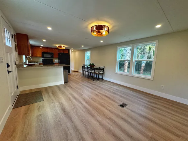 a view of a living room and dining room
