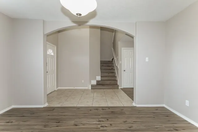 a kitchen with stainless steel appliances granite countertop a sink and a stove