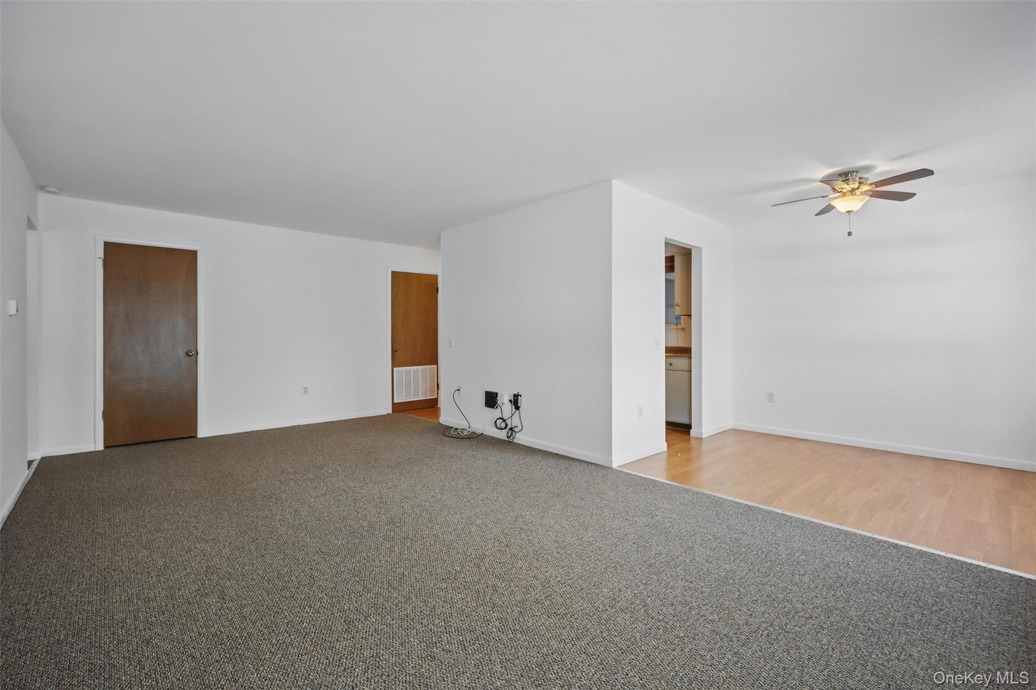 201 Commons Way, Unit E Fishkill, NY 12524 - Photo 8 of 30 Spare room featuring light carpet and ceiling fan