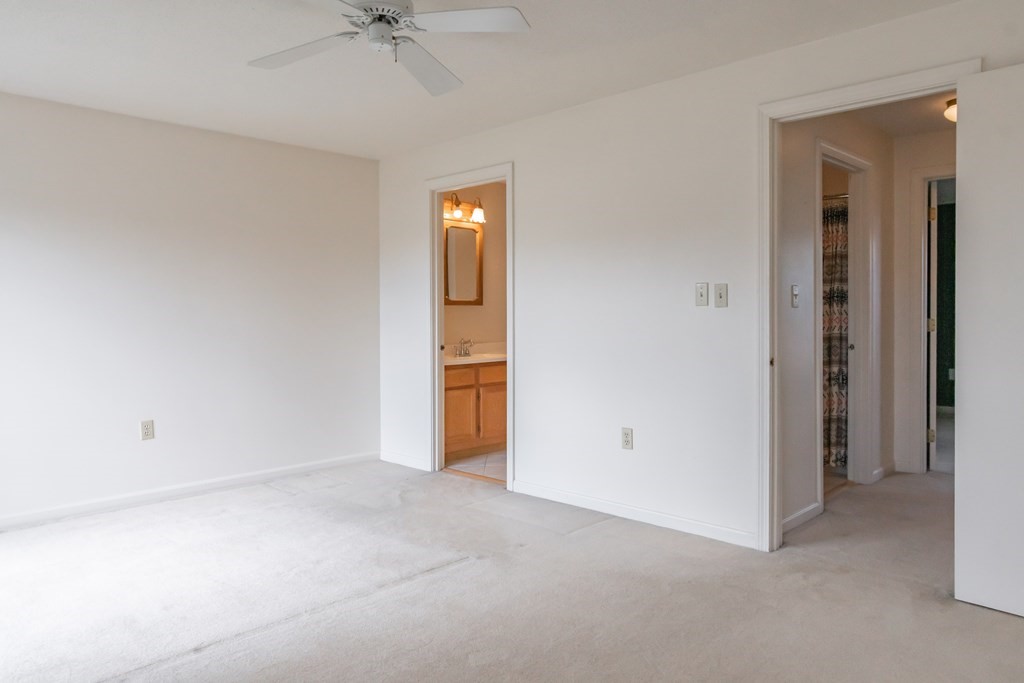 3 East Ridge Road, Unit 3 Merrimack, NH 03054 - Photo 11 of 17 an empty room with a ceiling fan and entryway