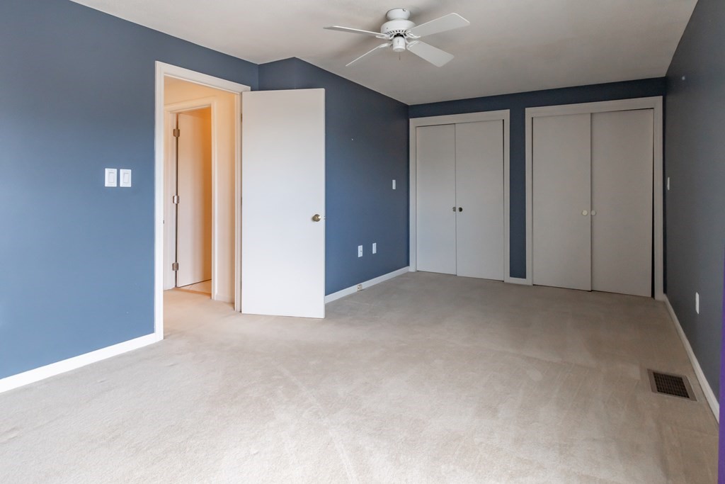 3 East Ridge Road, Unit 3 Merrimack, NH 03054 - Photo 14 of 17 a view of an empty room with a ceiling fan