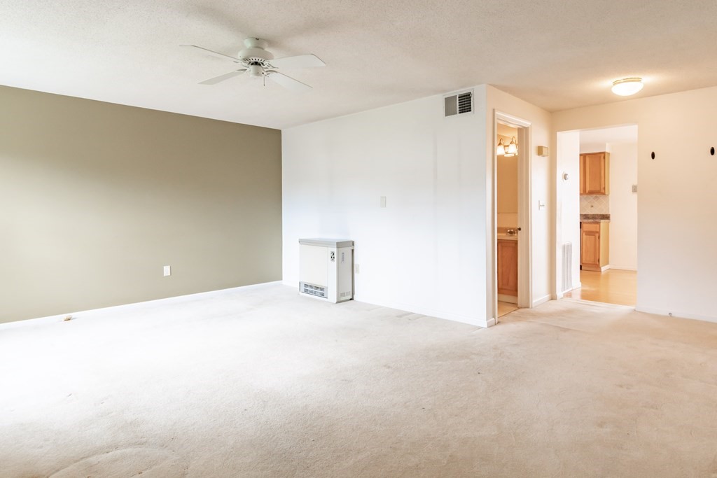 3 East Ridge Road, Unit 3 Merrimack, NH 03054 - Photo 4 of 17 a view of an empty room with a cabinet