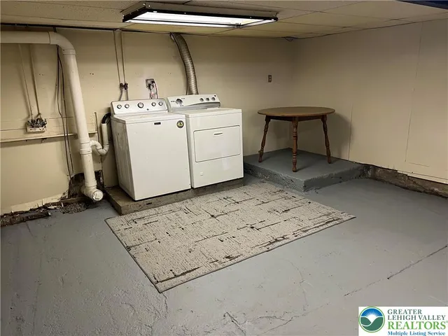 a view of an empty room with wooden walls