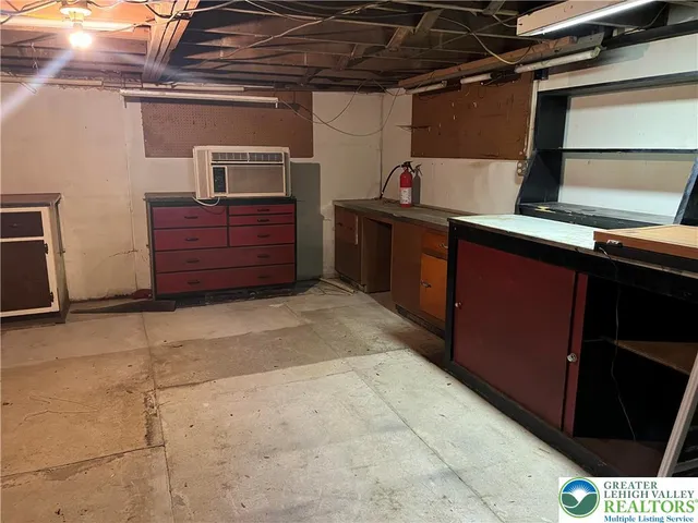 a backyard of a house with barbeque oven and outdoor seating