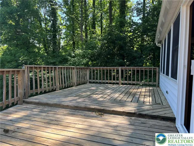 a view of balcony with wooden floor