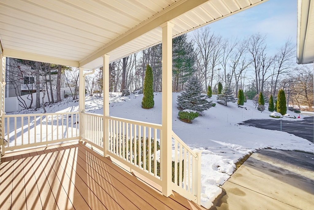191 Scotland Road, Unit 2 Newbury, MA 01951 - Photo 4 of 37 a view of a porch with wooden floor and iron fence