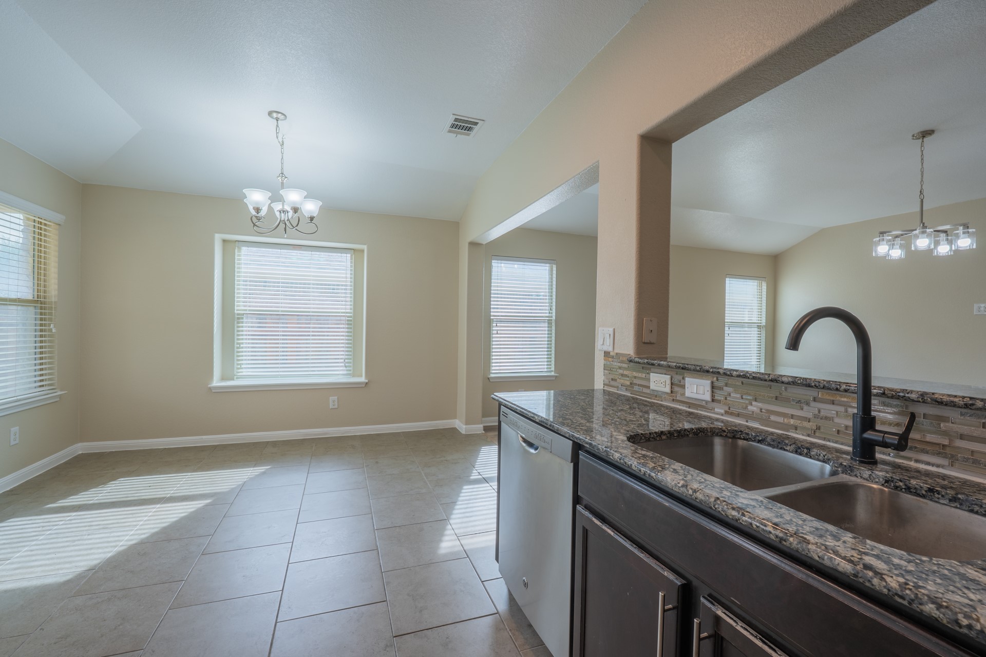 624 Joppa Road Leander, TX 78641 - Photo 13 of 36 a kitchen with a sink cabinets and window
