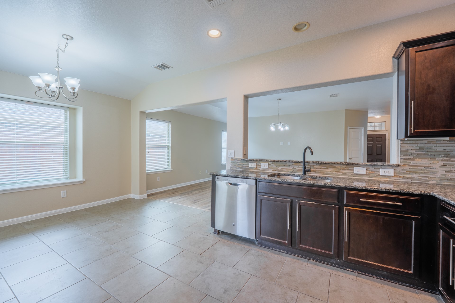 624 Joppa Road Leander, TX 78641 - Photo 14 of 36 a large kitchen with a sink and stove