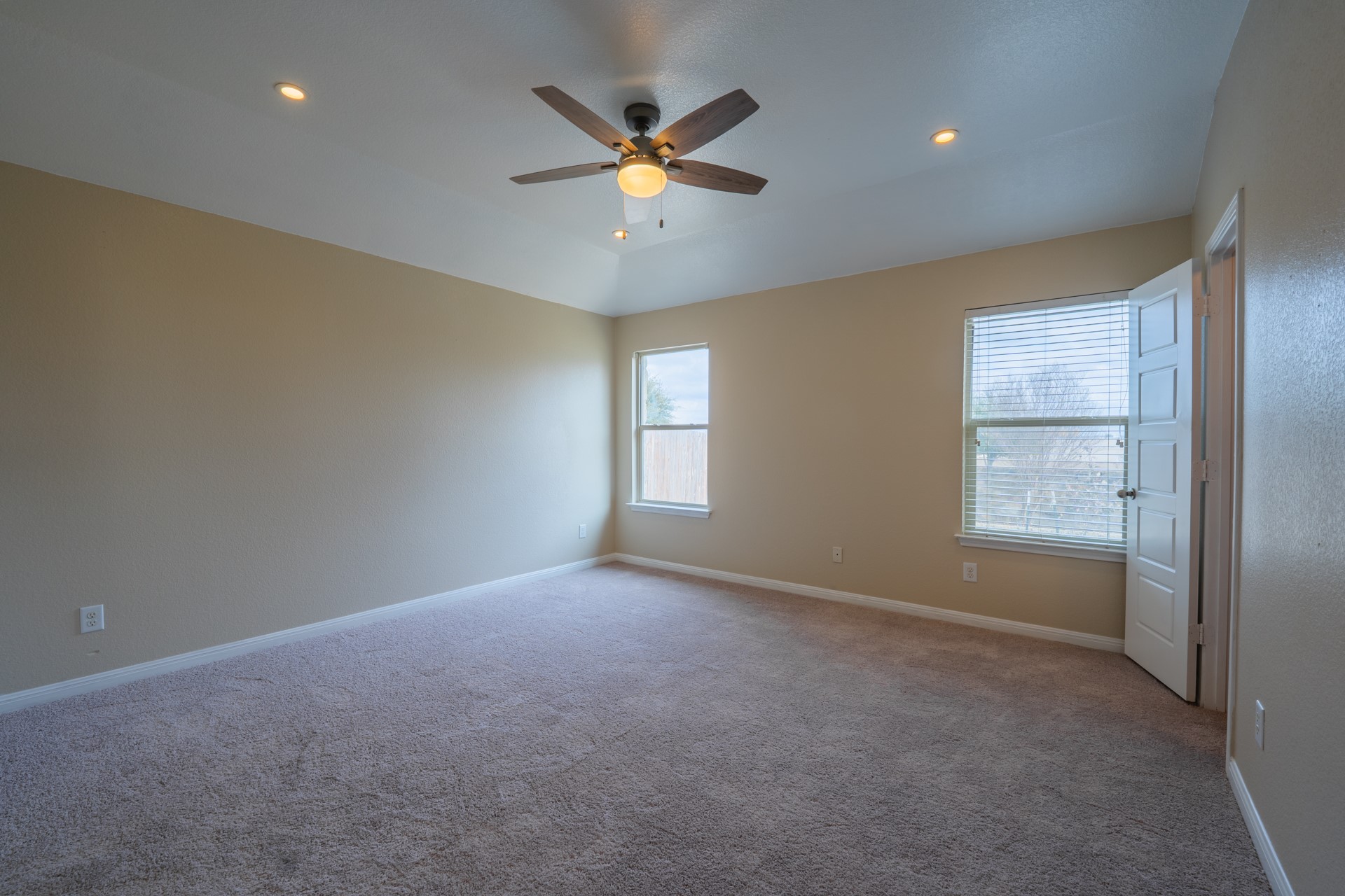 624 Joppa Road Leander, TX 78641 - Photo 17 of 36 a view of an empty room with a ceiling fan