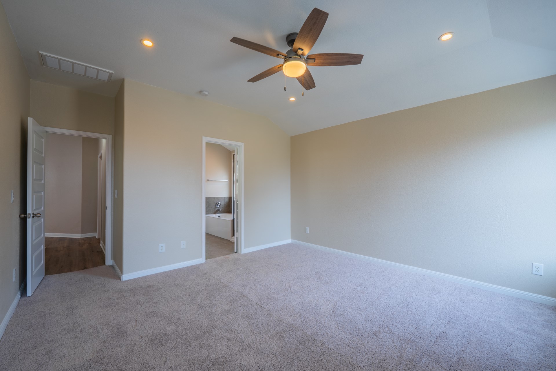 624 Joppa Road Leander, TX 78641 - Photo 18 of 36 a view of an empty room with a ceiling fan