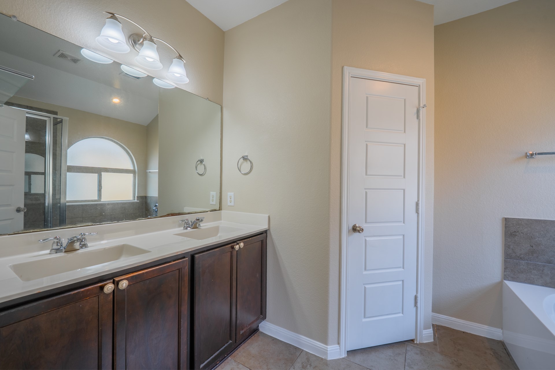 624 Joppa Road Leander, TX 78641 - Photo 21 of 36 a bathroom with a double vanity sink and a mirror