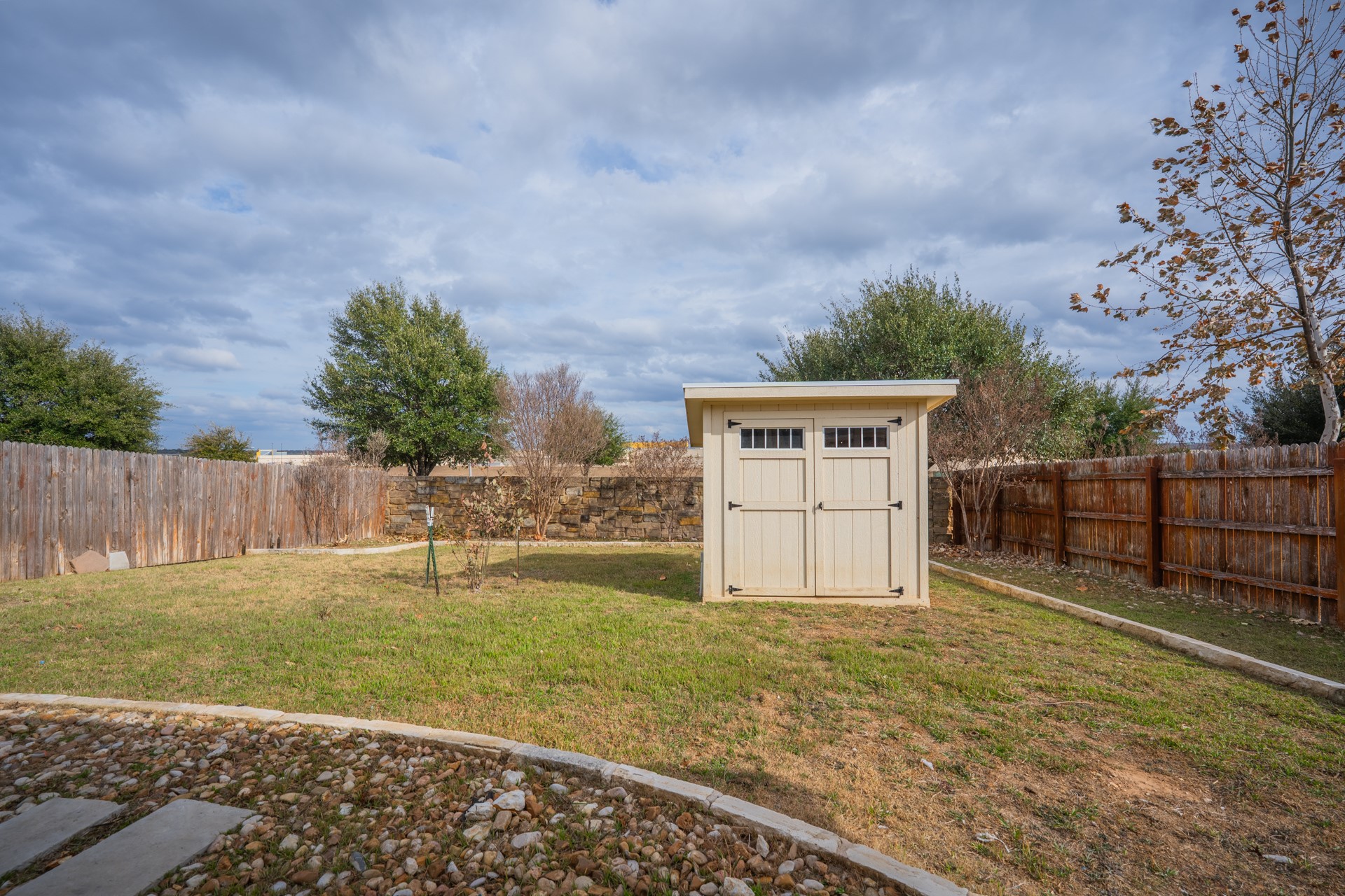 624 Joppa Road Leander, TX 78641 - Photo 30 of 36 a view of a backyard with wooden fence