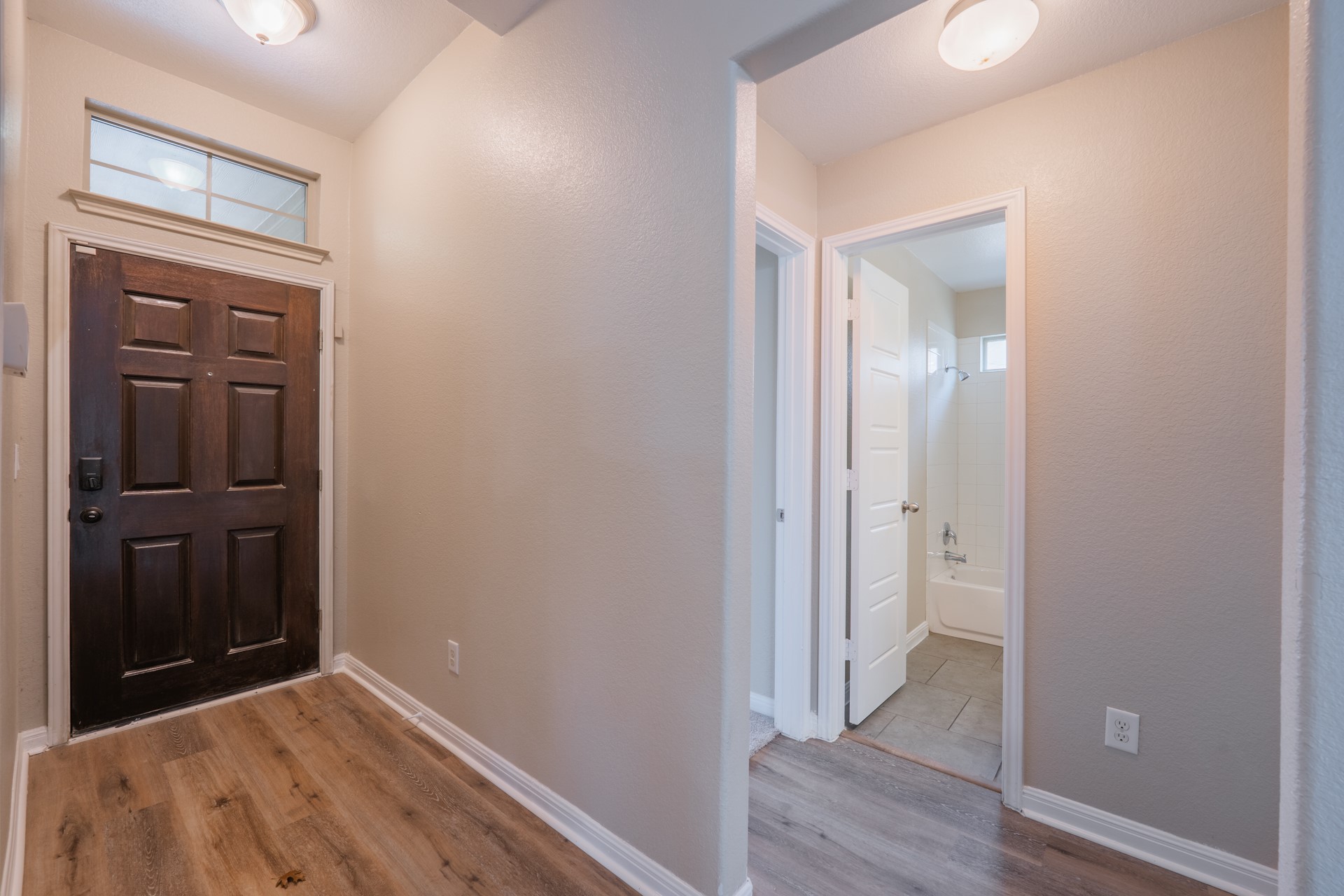 624 Joppa Road Leander, TX 78641 - Photo 3 of 36 a view of a hallway with wooden floor