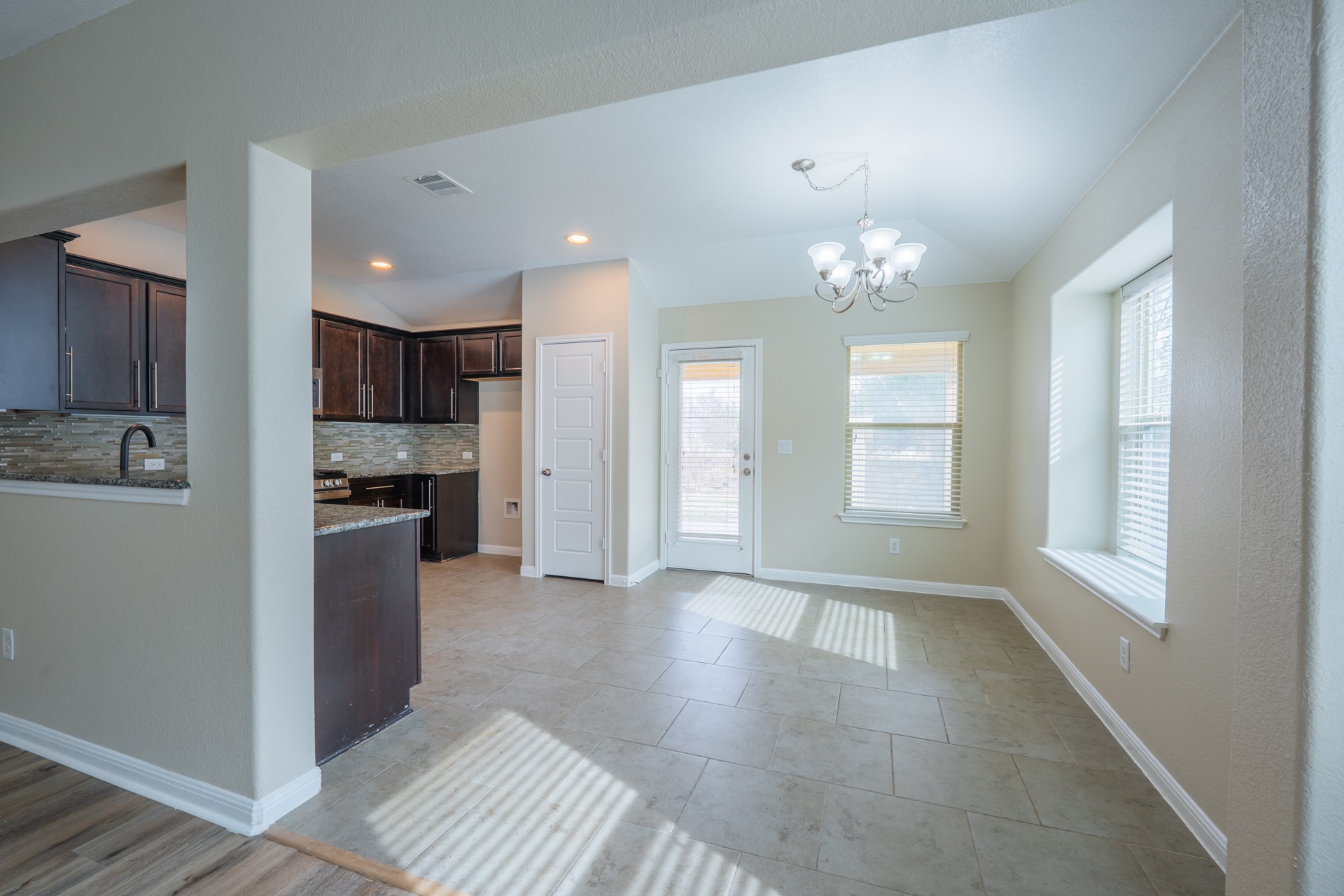 624 Joppa Road Leander, TX 78641 - Photo 7 of 36 a view of a kitchen with a stove cabinets and a kitchen