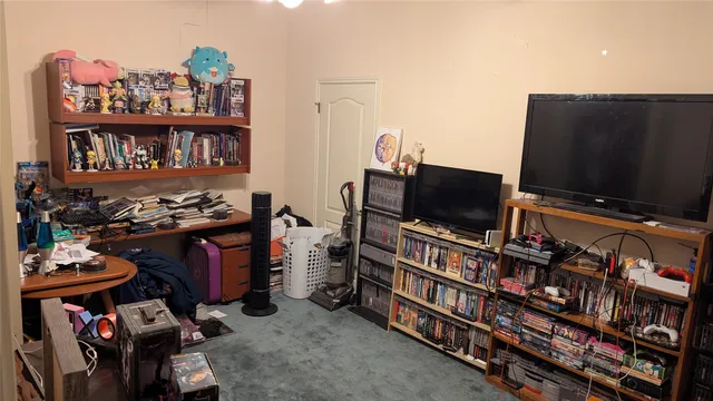 a room with furniture and a flat screen tv