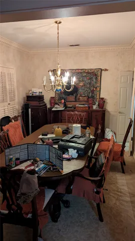 a view of room with furniture and clothes