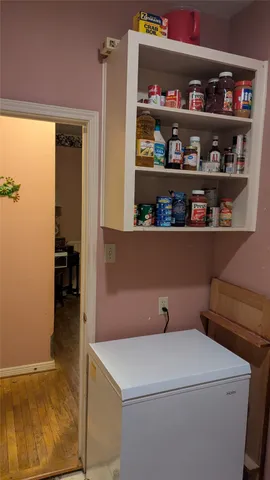 a bathroom with a toilet a sink and a mirror