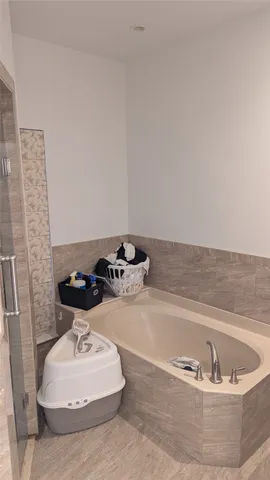 a living room with furniture and a mirror