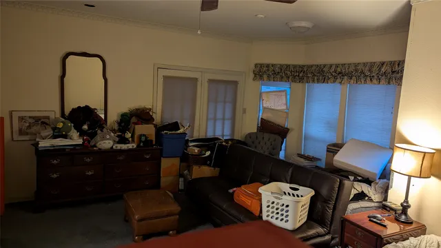 a bedroom with bed and a chandelier