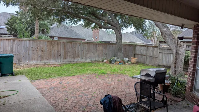 a backyard of a house with outdoor seating and green space