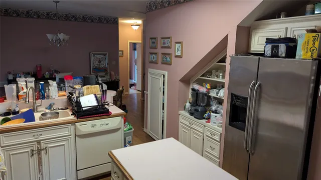 a kitchen with refrigerator and washer