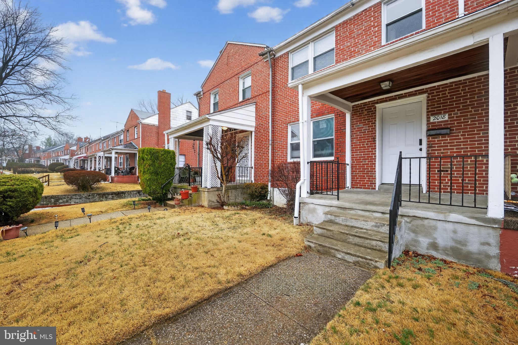 2018 Winford Road Baltimore, MD 21239 - Photo 2 of 29 a front view of a house with a yard