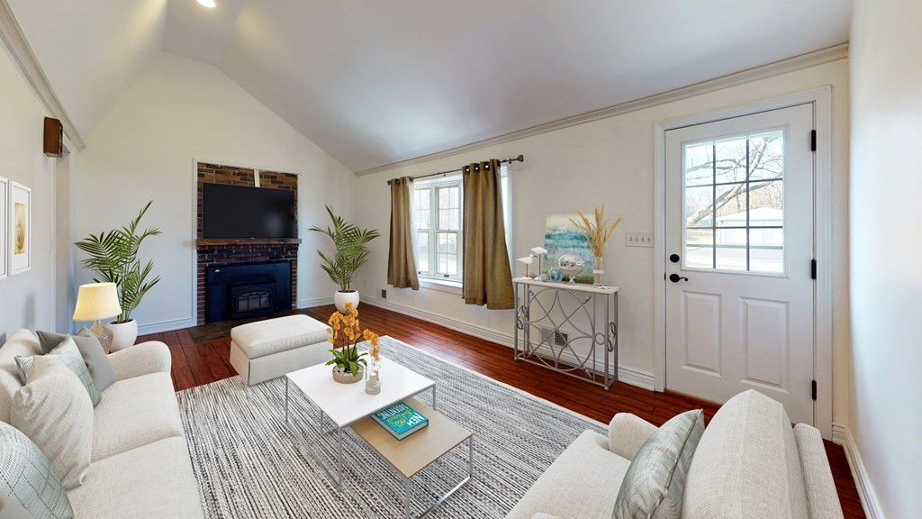 6 Egypt Beach Road Scituate, MA 02066 - Photo 2 of 29 a living room with furniture and a flat screen tv