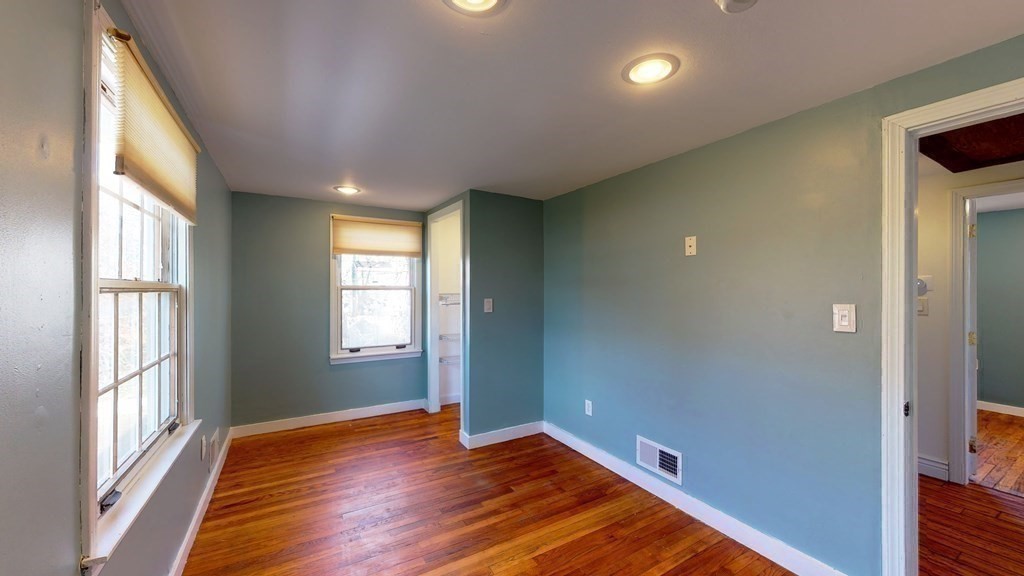 6 Egypt Beach Road Scituate, MA 02066 - Photo 26 of 29 a view of empty room with wooden floor and fan