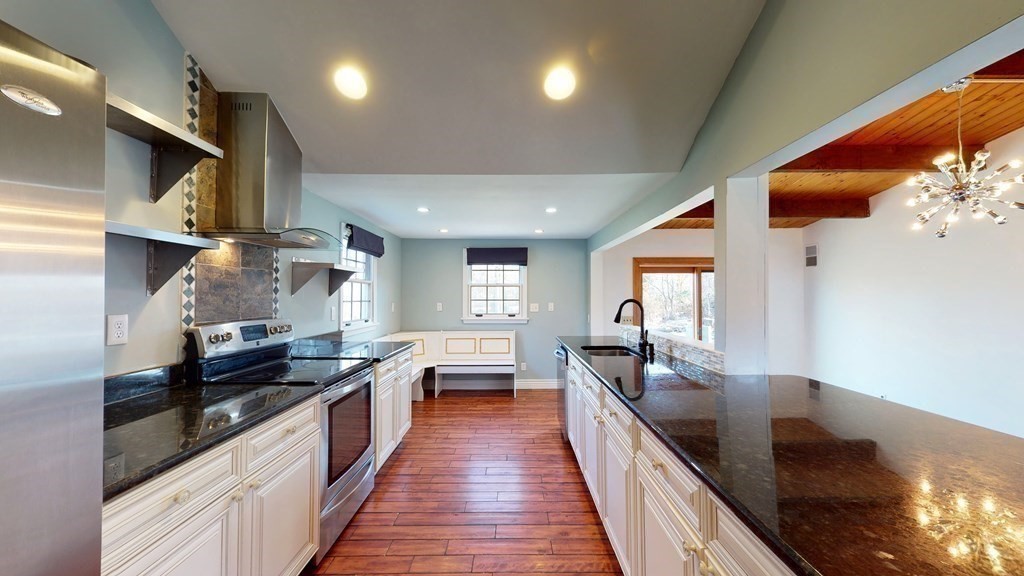 6 Egypt Beach Road Scituate, MA 02066 - Photo 3 of 29 a kitchen with stainless steel appliances granite countertop sink stove and refrigerator