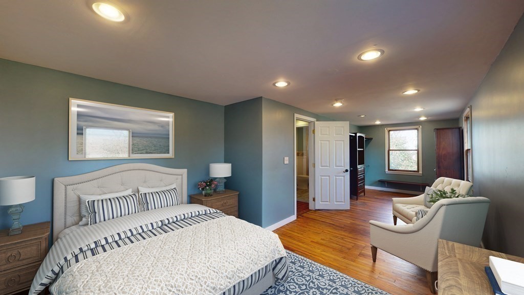 6 Egypt Beach Road Scituate, MA 02066 - Photo 6 of 29 a bedroom with a bed and wooden floor