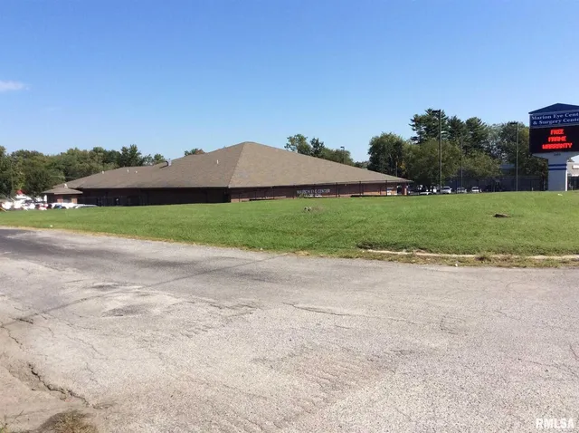 a view of a golf course with a lake