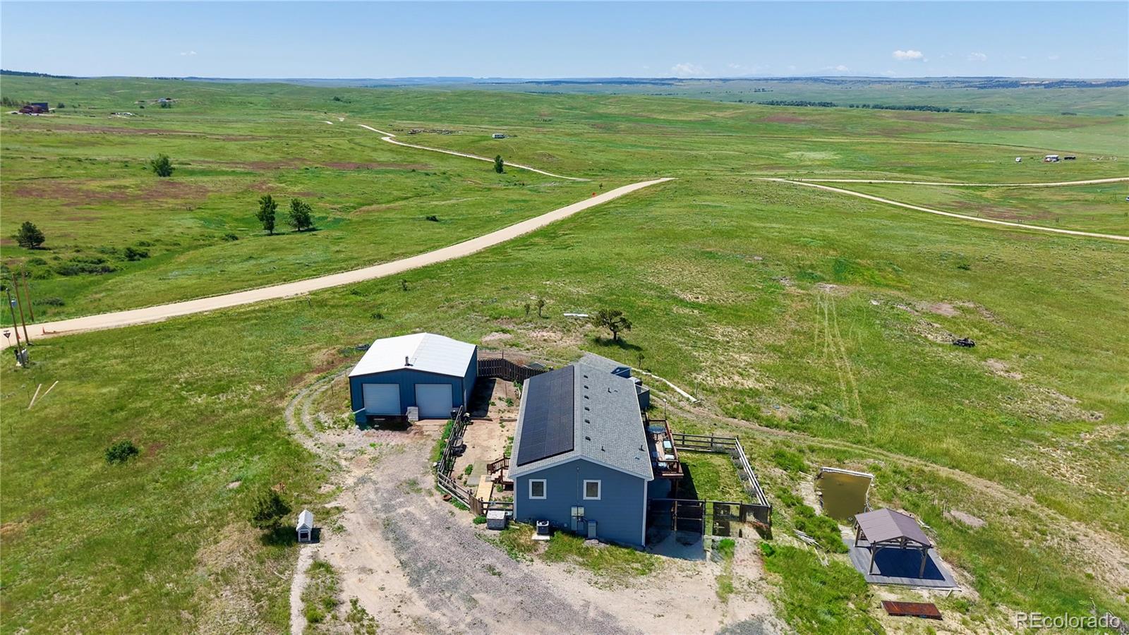 40291 Gold Nugget Road Deer Trail, CO 80105 - Photo 1 of 47 a view of a field with an ocean