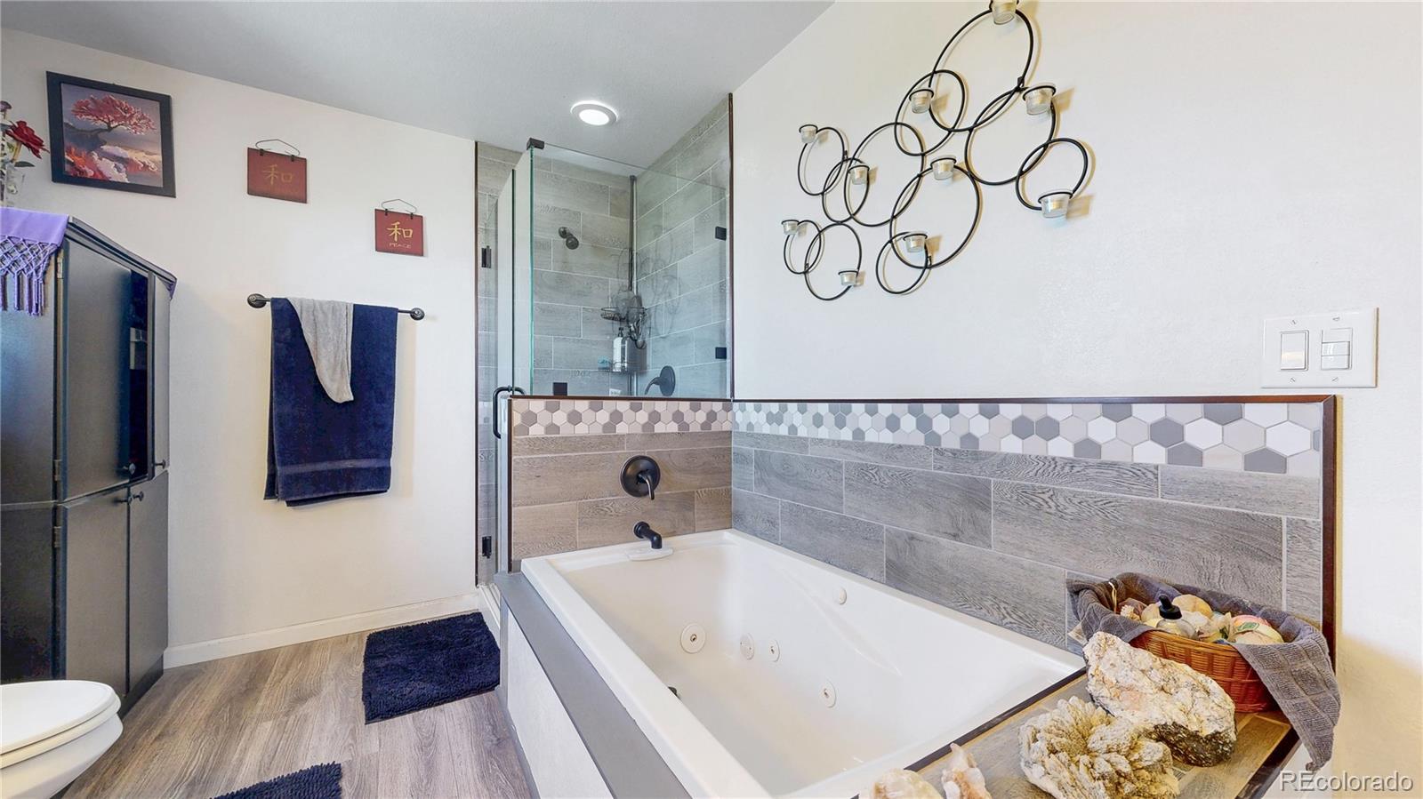 40291 Gold Nugget Road Deer Trail, CO 80105 - Photo 25 of 47 a bathroom with a tub and a shower