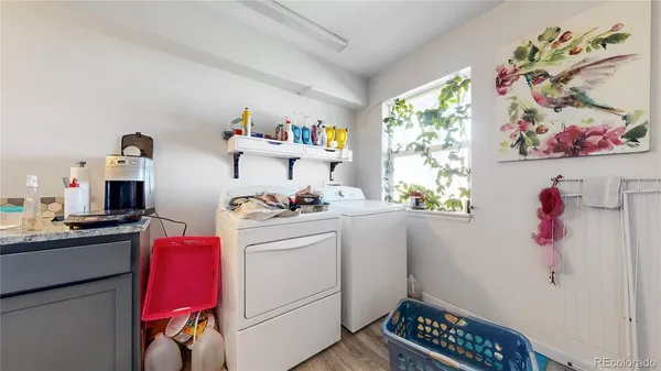 a storage room with wooden floor and cabinets